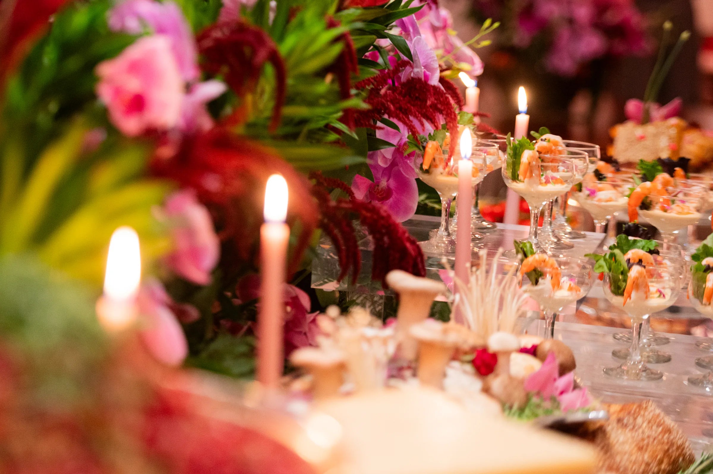 Candlelit event table with orchids and shrimp cocktail